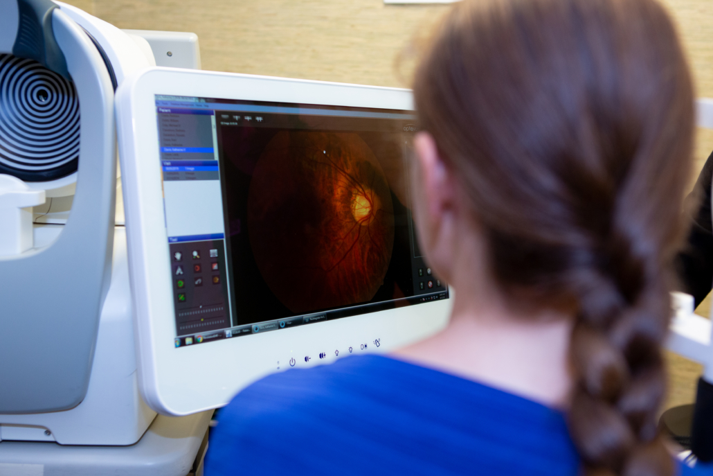 Patient sitting in front of a screen showing imaging results
